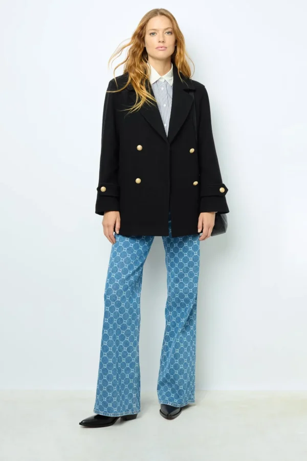 Shop Flared jeans with monogram - ANNA Coats