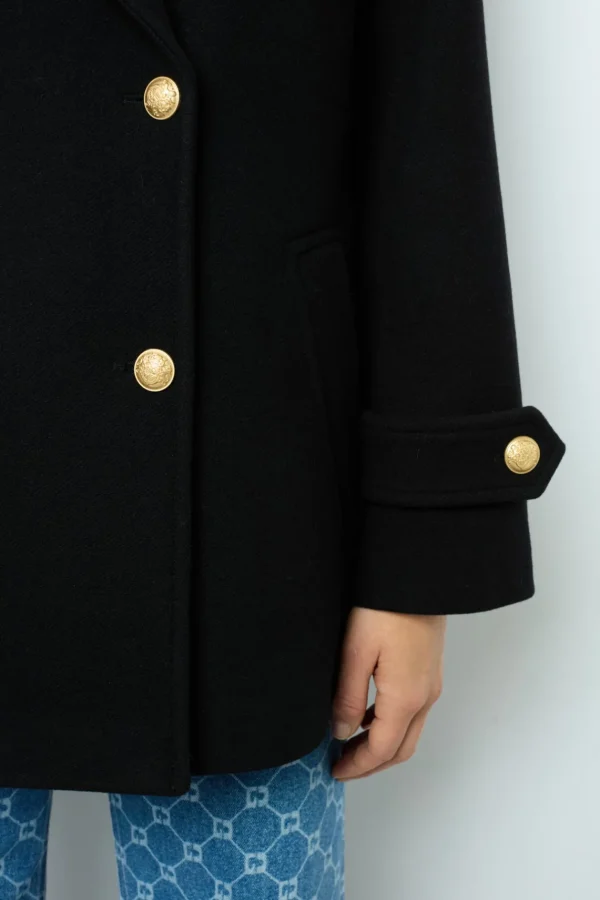 Shop Flared jeans with monogram - ANNA Coats